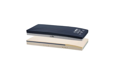 Stacked massage therapy cushions in dark blue and beige with control panels on top