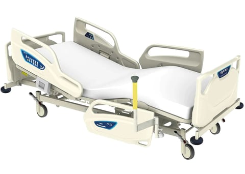 Medical adjustable hospital bed with cream-colored side rails, white mattress, and wheeled base