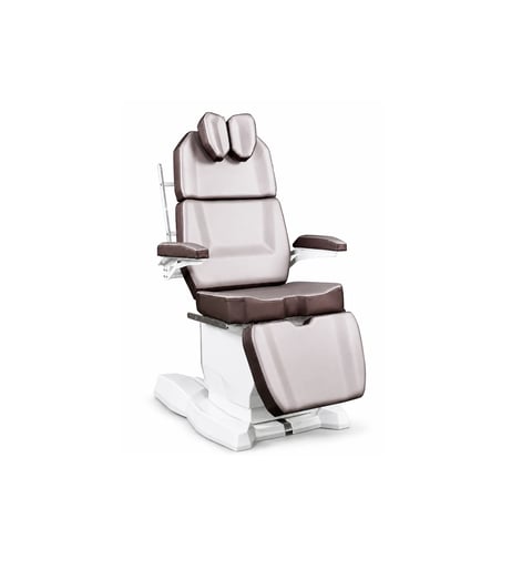 White and brown medical examination chair with padded headrest, armrests, and footrest on white base