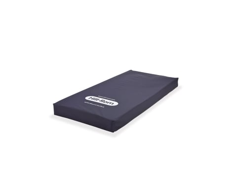 Dark blue medical mattress with white label on angled surface